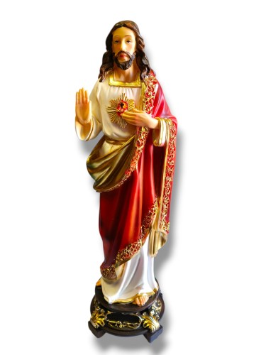 Figura Serce Jezusa na brązowej podstawie ze złotymi ornamentami.jpg
